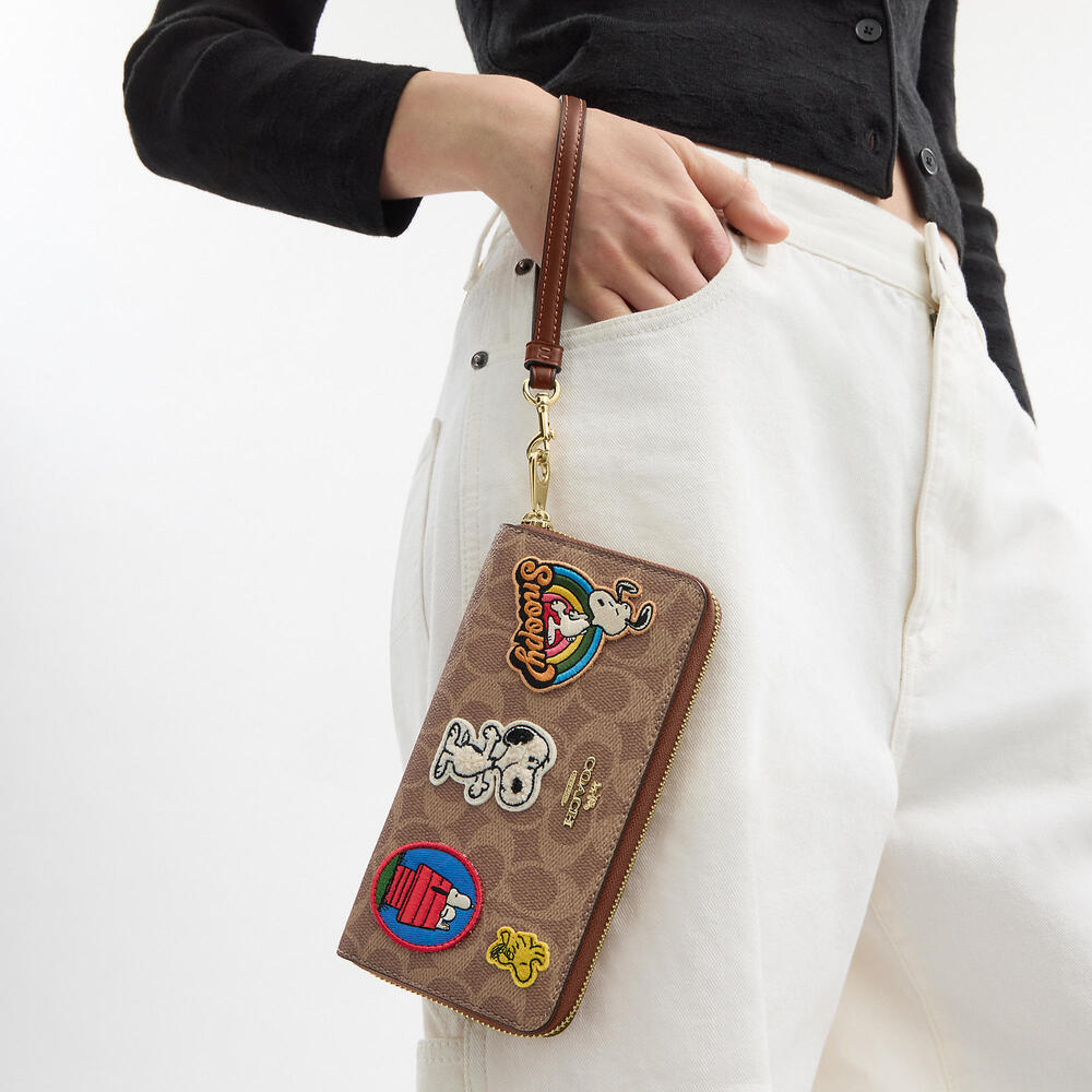 Coach X Peanuts Long Zip Around Wallet In Signature Canvas With Patches